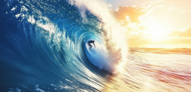 Surfer skillfully rides a wave during a vibrant sunset over the ocean. Surfer skillfully rides a wave during a vibrant sunset over the ocean.
